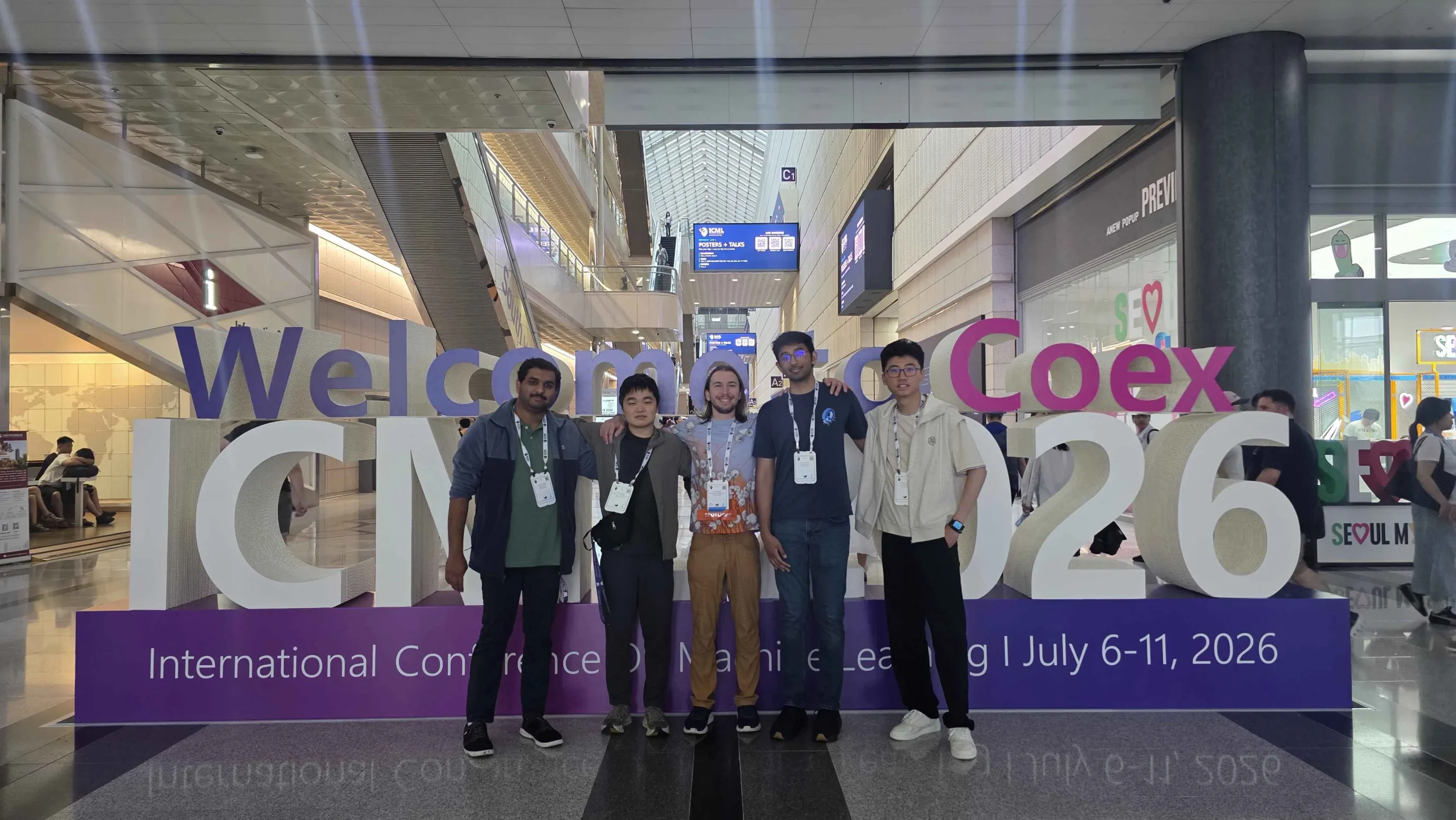 Five Math AI Lab members at the ICML 2026 display at COEX