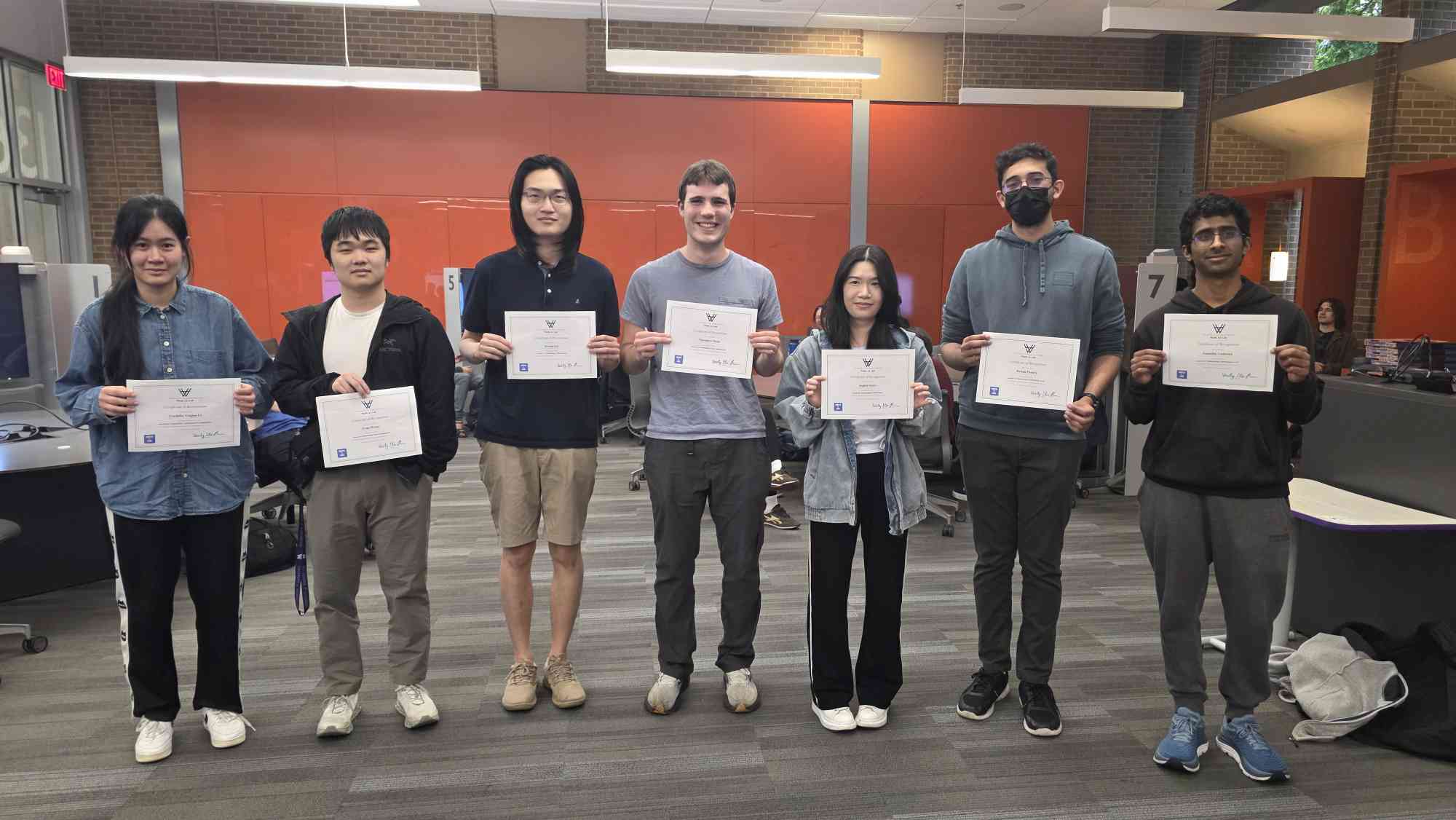 Seven Math AI Lab members each holding a certificate of recognition at Spring 2026 demo day
